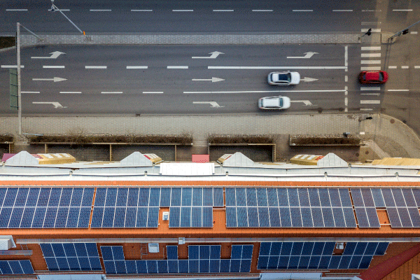 aerial-view-of-solar-photo-voltaic-panels-system-on-apartment-building-roof-renewable-ecological-green-energy-production-concept