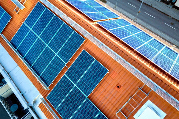 top-view-of-blue-solar-panels-on-high-apartment-building-roof